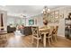 Bright dining area with a farmhouse table and view to the living room at 2952 Birchcreek Dr, Wesley Chapel, FL 33544