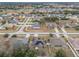 Aerial view showing a neighborhood with houses and solar panels at 3693 Celebration Dr, Brooksville, FL 34604