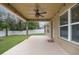 Covered back patio with ceiling fan, perfect for outdoor relaxation at 3693 Celebration Dr, Brooksville, FL 34604