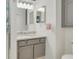 Bathroom with granite countertop and updated vanity at 3985 Mermoor Dr, Palm Harbor, FL 34685