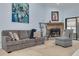 Living room features a fireplace, sofa, and armchair at 3985 Mermoor Dr, Palm Harbor, FL 34685