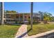 Home features a screened patio and brick pavers at 3998 South Cir, Largo, FL 33774