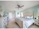Bright bedroom with a king-size bed and dresser at 3998 South Cir, Largo, FL 33774