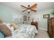 Guest bedroom with a comfortable bed and tropical decor at 3998 South Cir, Largo, FL 33774