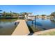 Private boat dock with lift, perfect for enjoying waterfront living at 3998 South Cir, Largo, FL 33774