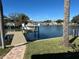 Stunning view of a peaceful canal with a private dock and boat lift at 3998 South Cir, Largo, FL 33774