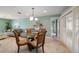 Casual dining area with round glass table and four chairs at 3998 South Cir, Largo, FL 33774