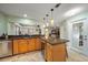 Island kitchen with granite countertops and stainless steel appliances at 3998 South Cir, Largo, FL 33774