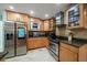 Modern kitchen featuring stainless steel appliances and light wood cabinets at 3998 South Cir, Largo, FL 33774