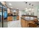 Modern kitchen with stainless steel appliances and light wood cabinets at 3998 South Cir, Largo, FL 33774