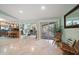 Open floor plan connecting the living room, kitchen, and outdoor patio at 3998 South Cir, Largo, FL 33774