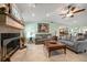 Cozy living room with fireplace and comfortable seating at 3998 South Cir, Largo, FL 33774