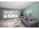 Living room with comfortable seating and large windows at 3998 South Cir, Largo, FL 33774