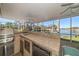 Outdoor kitchen with grill and water views at 3998 South Cir, Largo, FL 33774