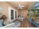 Screened patio with wicker furniture at 3998 South Cir, Largo, FL 33774