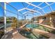 Enclosed pool and spa with water views at 3998 South Cir, Largo, FL 33774
