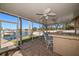 Covered patio with outdoor kitchen and canal views at 3998 South Cir, Largo, FL 33774