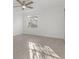 Sunny bedroom with light gray floors and a window at 409 S Audubon Ave # 9, Tampa, FL 33609