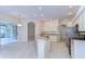 Open kitchen with island, granite counters, and stainless steel appliances at 5107 Lady Rose Ct, Lutz, FL 33558