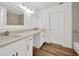 Modern bathroom with double vanity and wood floors at 5526 Southernview Dr, Zephyrhills, FL 33541