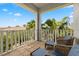 Private balcony with wicker furniture and scenic view at 6002 Yeats Manor Dr # 101, Tampa, FL 33616