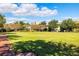 Expansive community lawn with walking path and gazebo at 6002 Yeats Manor Dr # 101, Tampa, FL 33616