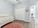 Bedroom with crib, closet, and neutral color scheme at 631 12Th N Ave, Safety Harbor, FL 34695