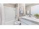 Clean bathroom with shower/tub combo, granite countertop, and white vanity at 6963 Broad River Ave, Land O Lakes, FL 34638