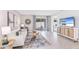 Living room with light sofa, coffee table, and access to a private patio at 6963 Broad River Ave, Land O Lakes, FL 34638