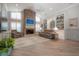 Living room with stone fireplace, built-in shelving, and hardwood floors at 7704 Lake Cypress Dr, Odessa, FL 33556