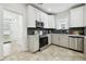 Modern kitchen with stainless steel appliances and white cabinets at 810 E Conover St, Tampa, FL 33603