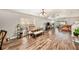 Dining area with wood floors and a table for six people at 8729 Sheldon Creek Blvd, Tampa, FL 33615