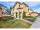 Two-story townhome with a grassy yard and walkway at 8729 Sheldon Creek Blvd, Tampa, FL 33615