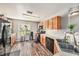 Kitchen with wood cabinets, black appliances, and double sink at 8729 Sheldon Creek Blvd, Tampa, FL 33615