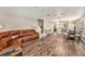 Open floor plan with a large sectional sofa and dining area at 8729 Sheldon Creek Blvd, Tampa, FL 33615