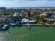 Aerial view of waterfront property with private dock and expansive water views at 981 Bay Esplanade, Clearwater Beach, FL 33767