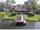 Waterfront property with a dock, and screened patio at 10020 Kenda Dr, Riverview, FL 33578