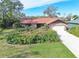 Single-story house with a spacious yard and driveway at 10020 Kenda Dr, Riverview, FL 33578