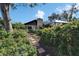 Landscaped front yard with a brick pathway at 10020 Kenda Dr, Riverview, FL 33578