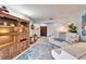 Living room with a white piano and built-in shelves at 10020 Kenda Dr, Riverview, FL 33578