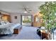 Spacious main bedroom with large window and sitting area at 10020 Kenda Dr, Riverview, FL 33578