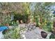 Relaxing brick patio with seating and greenery at 10020 Kenda Dr, Riverview, FL 33578