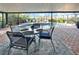 Relaxing poolside patio with seating for four at 10020 Kenda Dr, Riverview, FL 33578