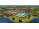 Community clubhouse with pool and tennis courts at 10043 Crooked Creek Dr # 202, Venice, FL 34293