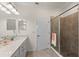 Bathroom with shower and double vanity at 10043 Crooked Creek Dr # 202, Venice, FL 34293