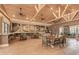 Relaxing coffee shop with tables and chairs in a community clubhouse at 10043 Crooked Creek Dr # 202, Venice, FL 34293