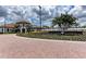 Community entrance with brick pavers and Sarasota National signage at 10043 Crooked Creek Dr # 202, Venice, FL 34293