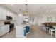 Modern kitchen with stainless steel appliances and an island at 10043 Crooked Creek Dr # 202, Venice, FL 34293