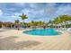 Resort-style pool with plenty of lounge chairs at 10043 Crooked Creek Dr # 202, Venice, FL 34293
