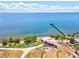 Aerial view of waterfront park with pier, gazebo, and lush landscaping at 1055 Philippe Pkwy, Safety Harbor, FL 34695